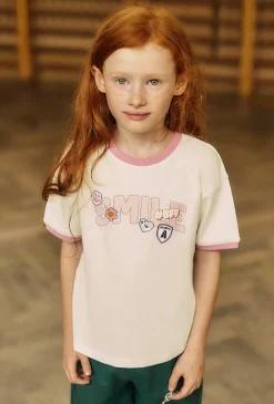 Bawełniany t-shirt dla dziewczynki - biały z napisem SMILE