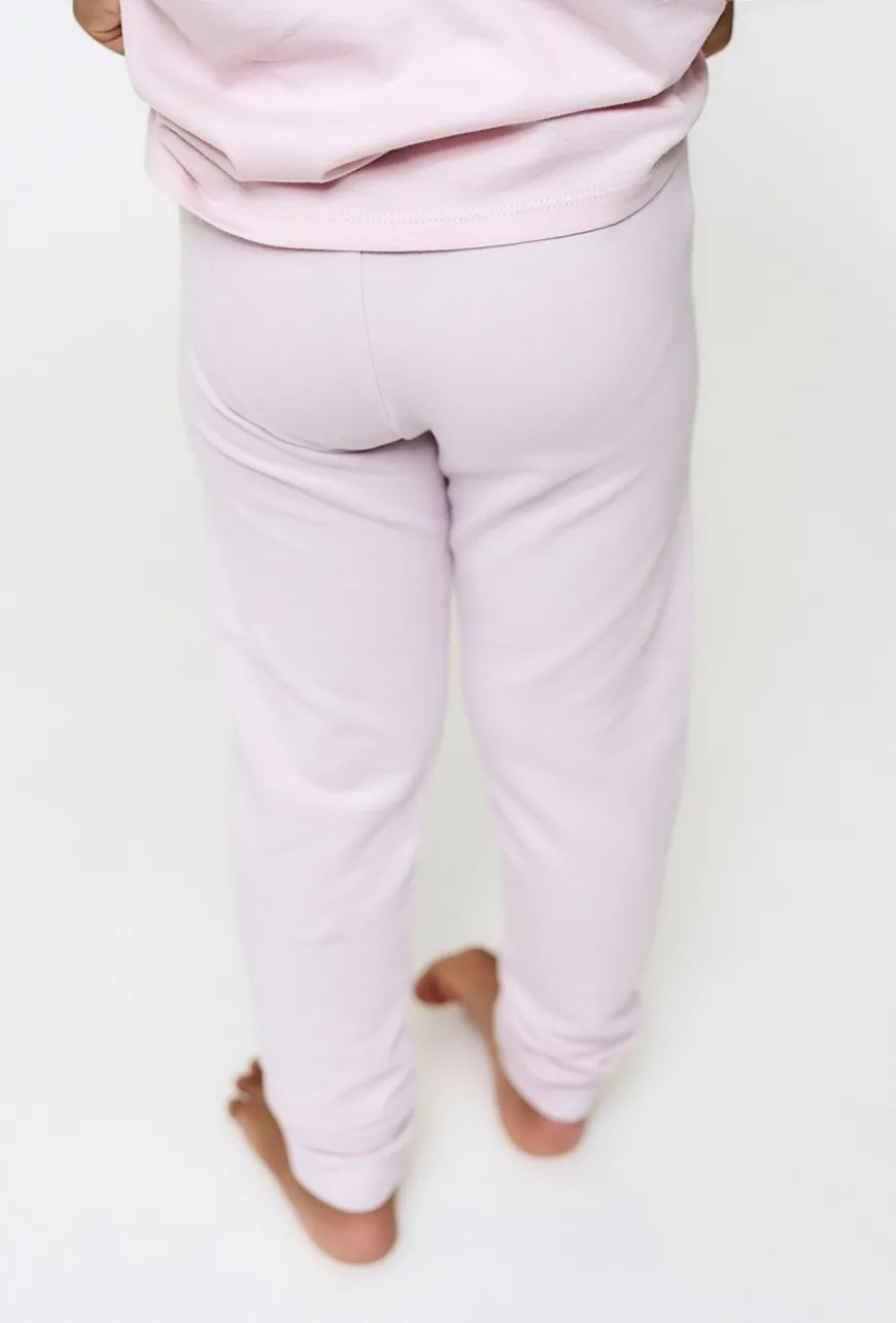 Jasnoróżowe legginsy z motylkami