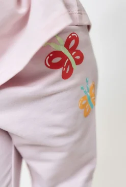 Jasnoróżowe legginsy z motylkami