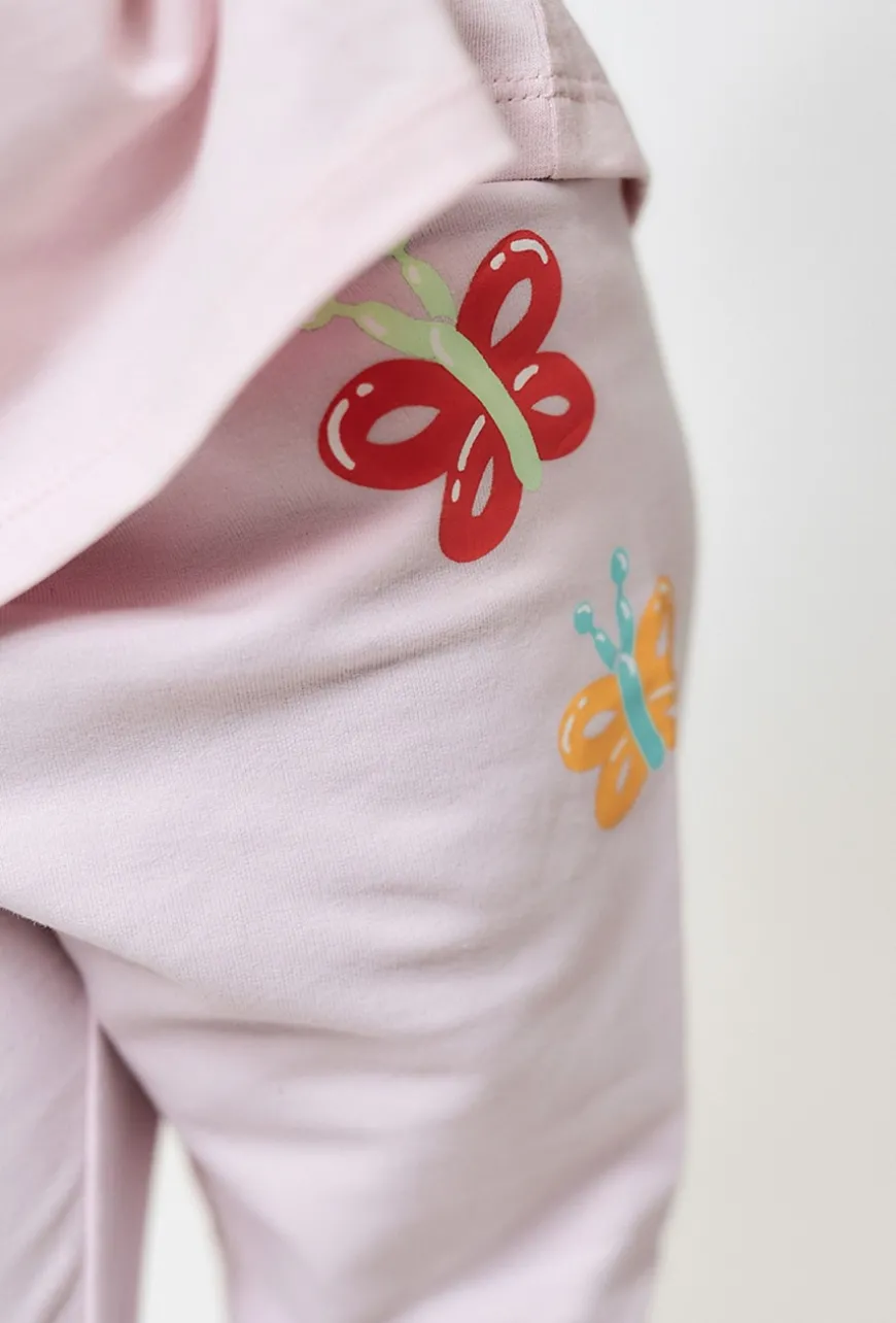 Jasnoróżowe legginsy z motylkami