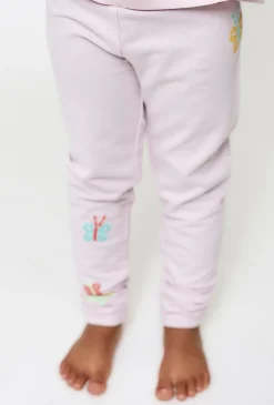 Jasnoróżowe legginsy z motylkami