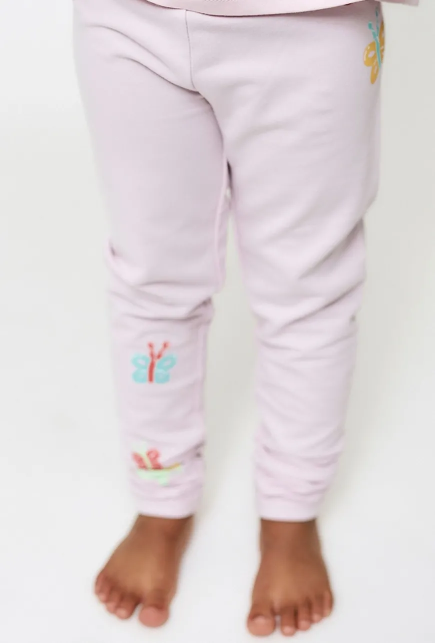 Jasnoróżowe legginsy z motylkami