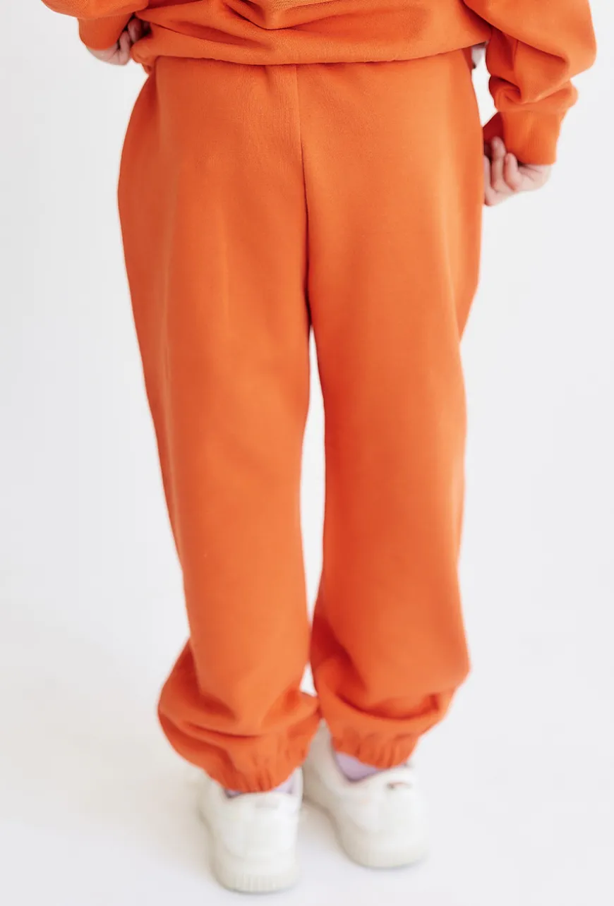 Pomarańczowe spodnie dresowe - unisex - Limited Edition
