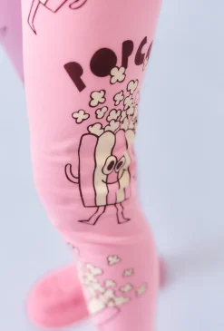 Różowe legginsy dziewczęce z motywem popcornu