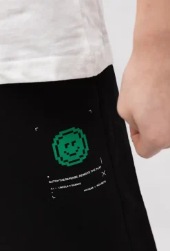 Spodnie dresowe chłopięce wide leg z napami i pikselowym printem