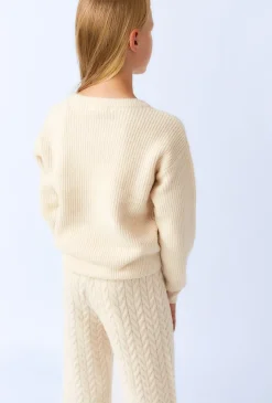 Sweter dziewczęcy ecru z dekoracyjnym splotem
